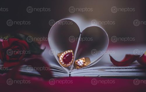 Find  the Image engagement,rings,heart,shaped,page,rose,background  and other Royalty Free Stock Images of Nepal in the Neptos collection.