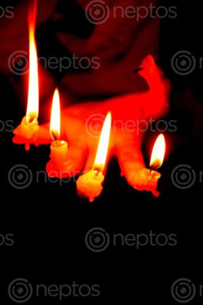 Find  the Image candle,finger#,burn#,stock,image#,nepal,_photographyby,sita,maya,shrestha  and other Royalty Free Stock Images of Nepal in the Neptos collection.