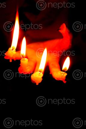 Find  the Image candle,finger#,burn#,stock,image#,nepal,_photographyby,sita,maya,shrestha  and other Royalty Free Stock Images of Nepal in the Neptos collection.