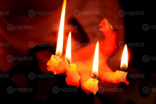 Find  the Image candle,finger#,burn#,stock,image#,nepal,_photographyby,sita,maya,shrestha  and other Royalty Free Stock Images of Nepal in the Neptos collection.