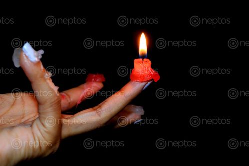 Find  the Image candle,finger#,burn#,stock,image#,nepal,_photographyby,sita,maya,shrestha  and other Royalty Free Stock Images of Nepal in the Neptos collection.