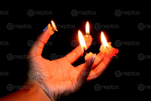 Find  the Image candle,finger#,burn#,stock,image#,nepal,_photographyby,sita,maya,shrestha  and other Royalty Free Stock Images of Nepal in the Neptos collection.