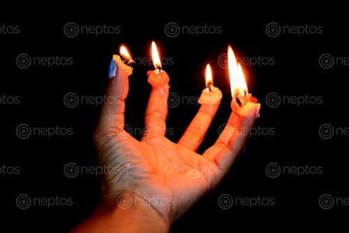 Find  the Image candle,finger#,burn#,stock,image#,nepal,_photographyby,sita,maya,shrestha  and other Royalty Free Stock Images of Nepal in the Neptos collection.