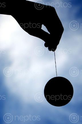 Find  the Image hand,#ball,image,dark,color,sky,background#,stock,image#,photography,sita,maya,shrestha  and other Royalty Free Stock Images of Nepal in the Neptos collection.